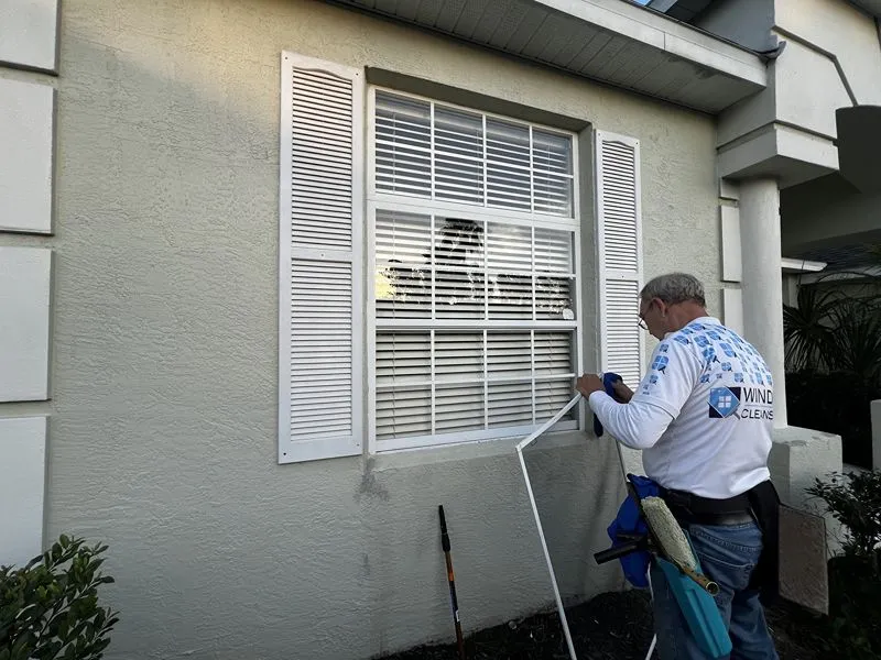Residential window cleaning service on a single-story home in Davenport FL