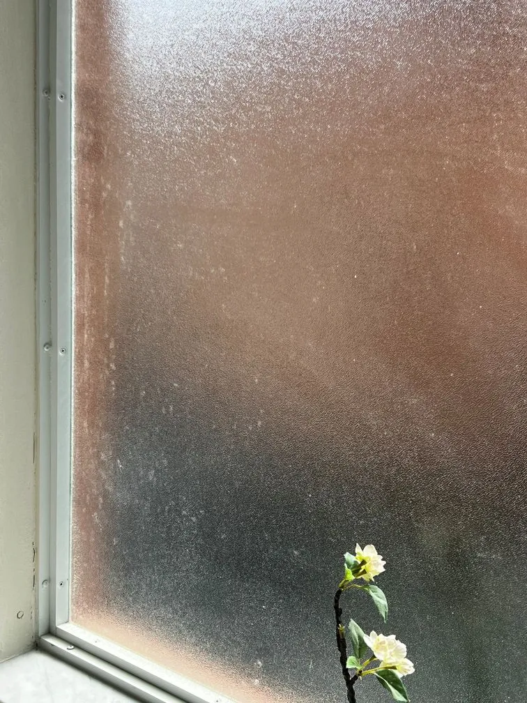 Window frame oxidation showing white residue